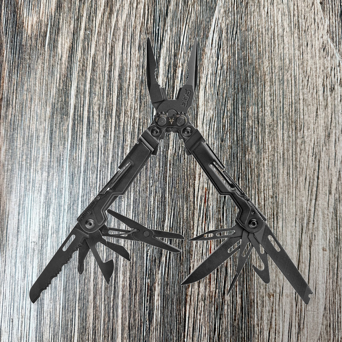 Black SOG PowerPint with pliers, file, scissors, and blades unfolded