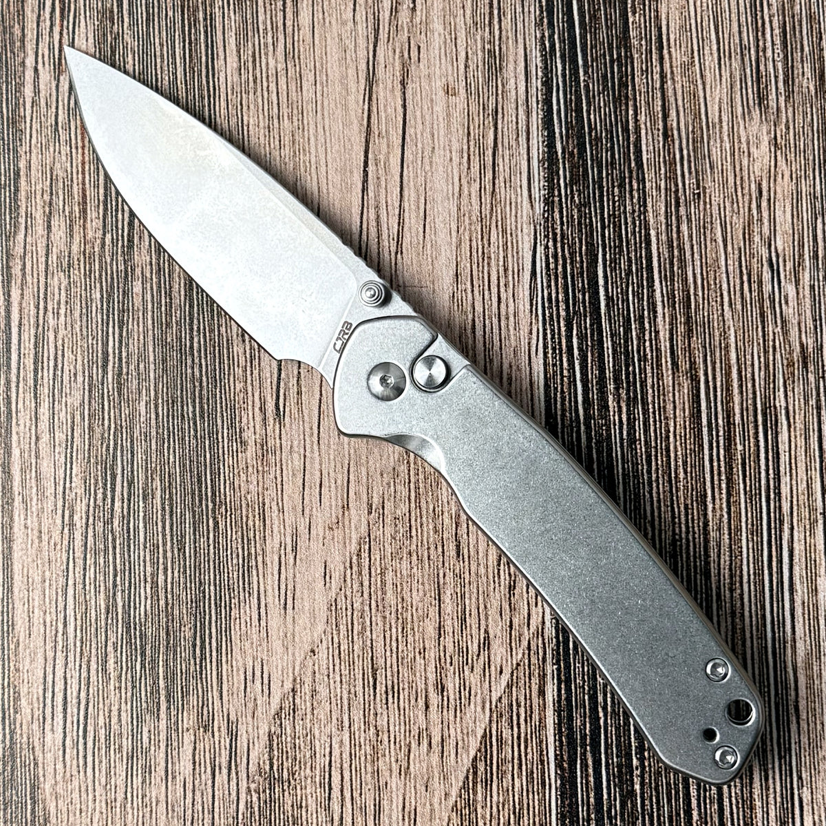 CJRB Pyrite with steel handle, thumb studs, and open stonewashed drop-point blade