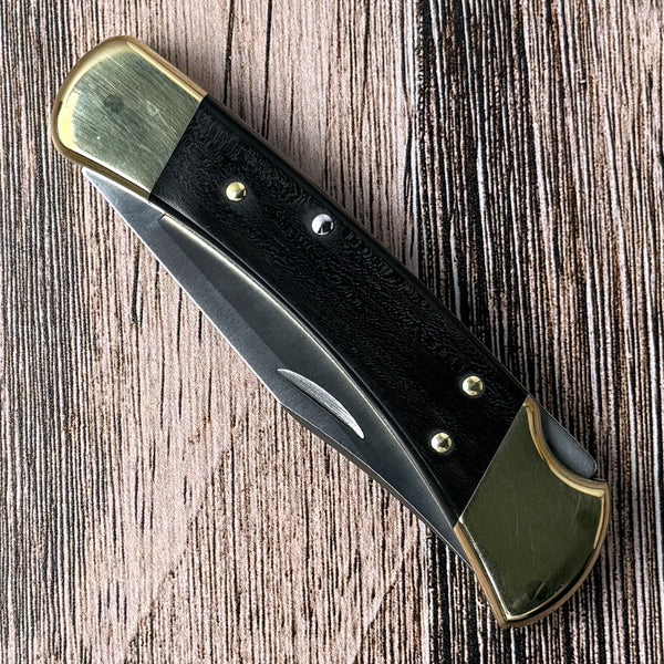 Buck 110 Hunter folding knife with ebony handle scales and brass bolsters